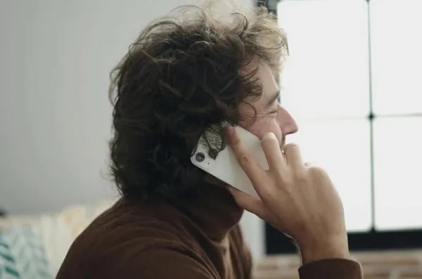 smiling man on phone